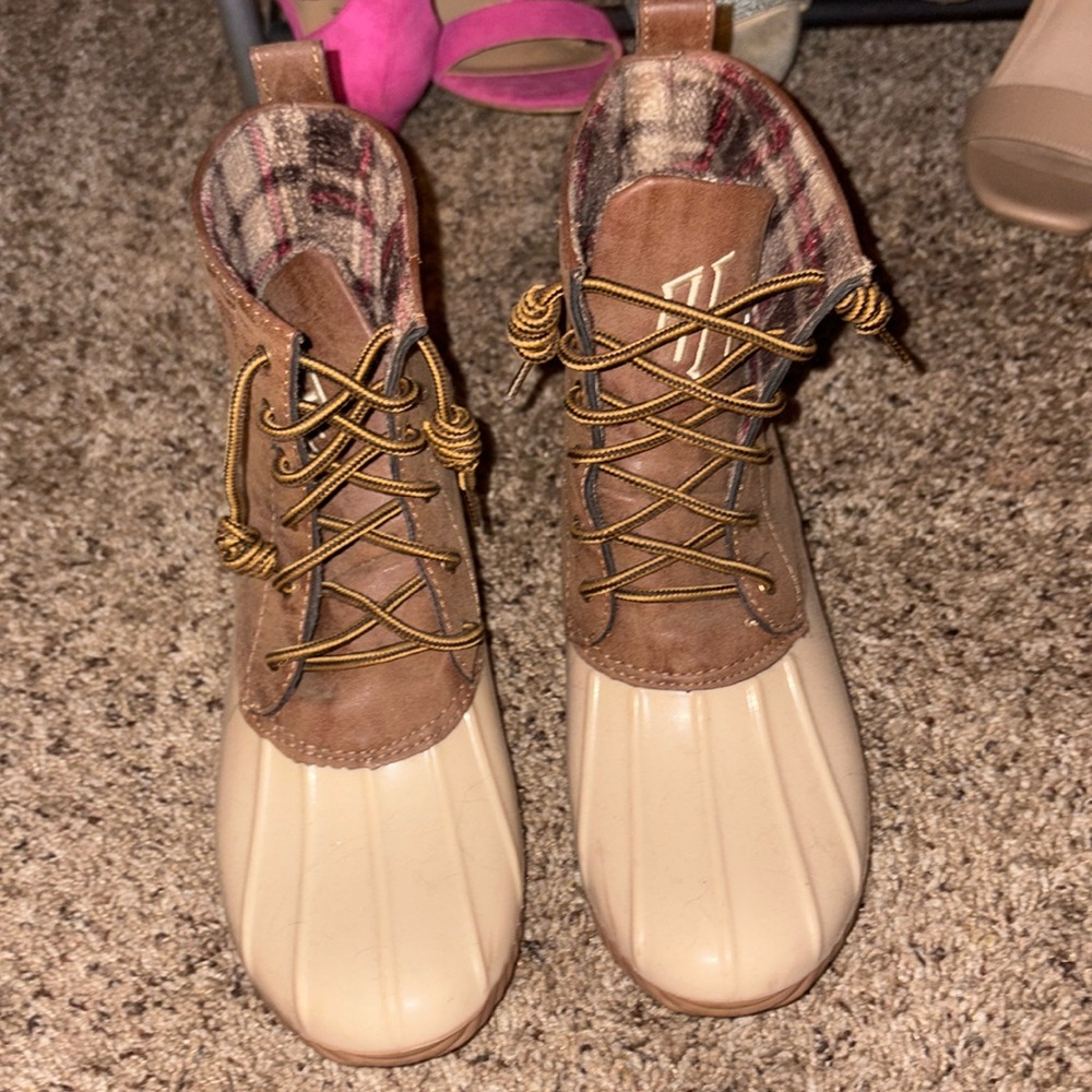 Duck boots they have initials on them .